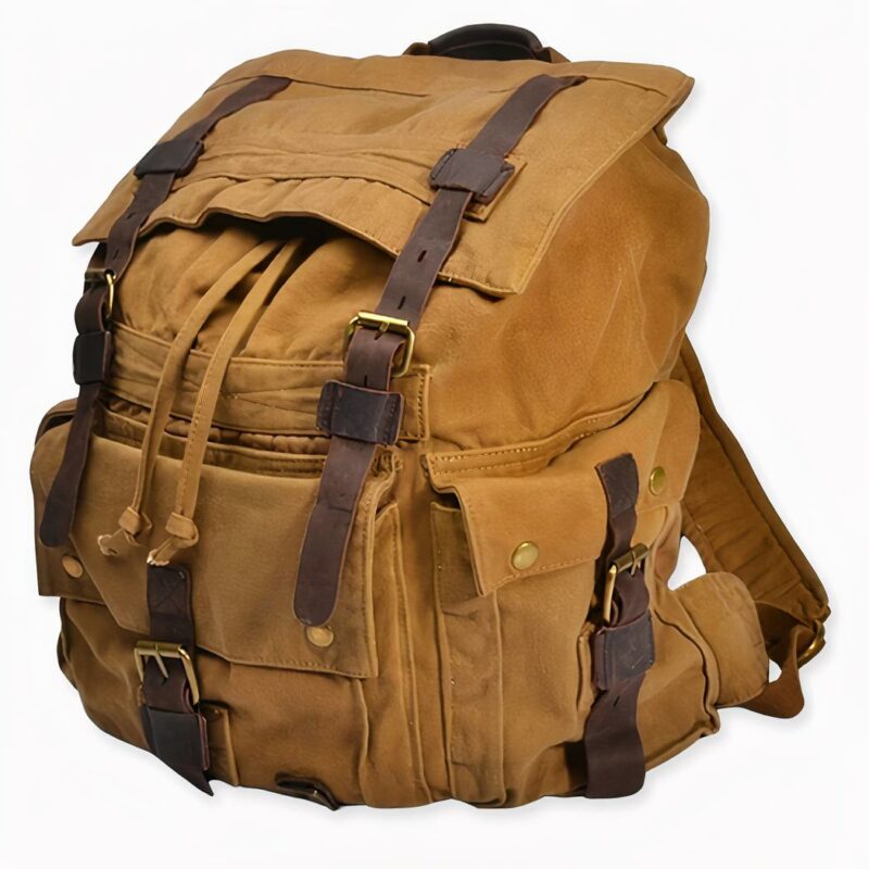 Sac_à_dos_vintage_en_toile_2 Zaino di tela vintage con sfondo grigio chiaro.